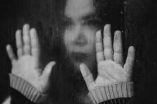 Dangers of PCP - Girl looking out of a rain soaked window